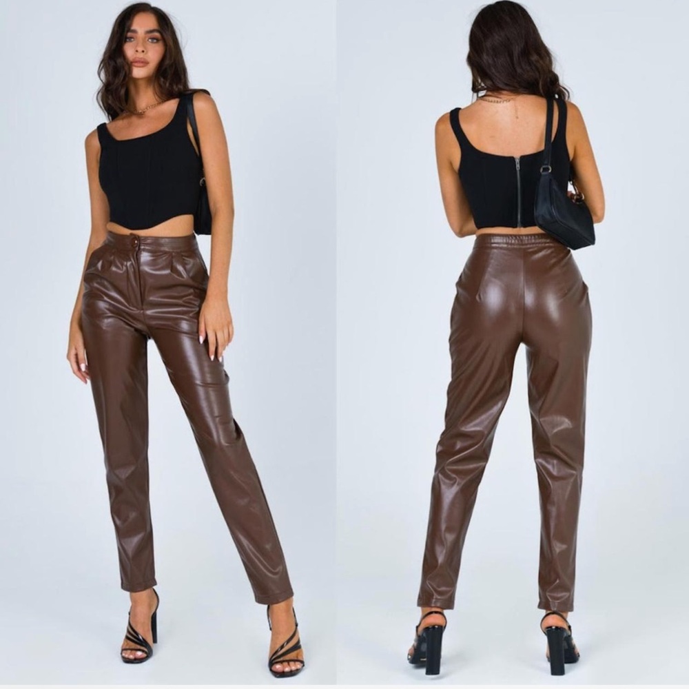 Princess Polly brown leather straight leg trousers.
